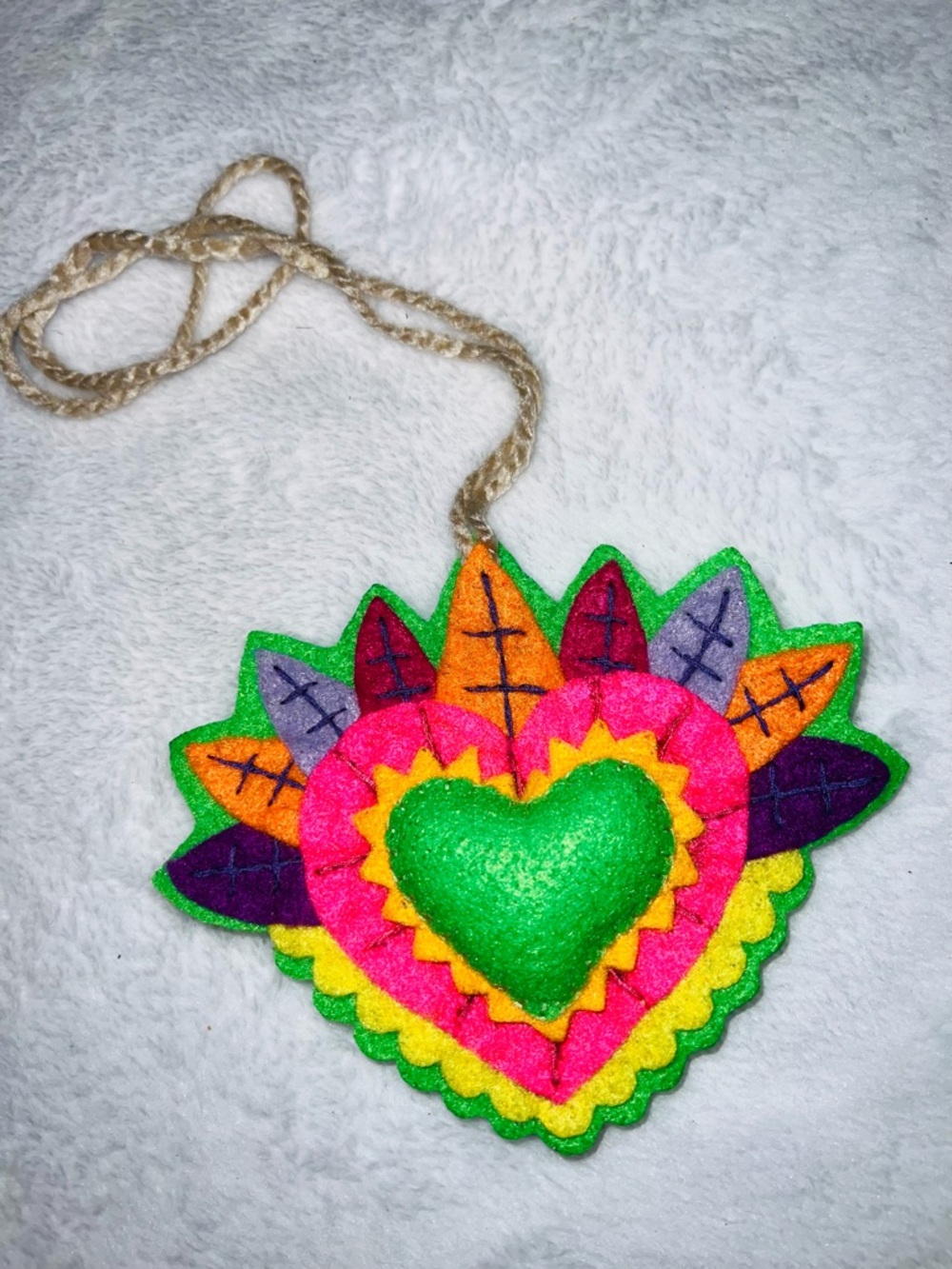 Hand Crafted Multicolor Felt Sacred Heart purse ornament.